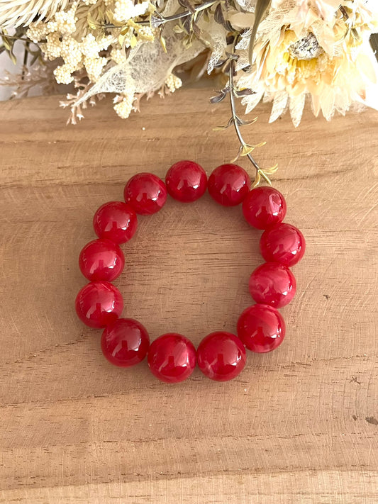 Bracelet élastique fait main.
Perles rondes en résine rose fuchsia
Bijou fantaisie fait main.